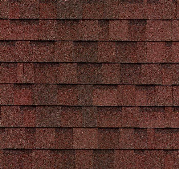 Bardeaux de toiture en asphalte brun-rouge, disposés en rangées se chevauchant.
