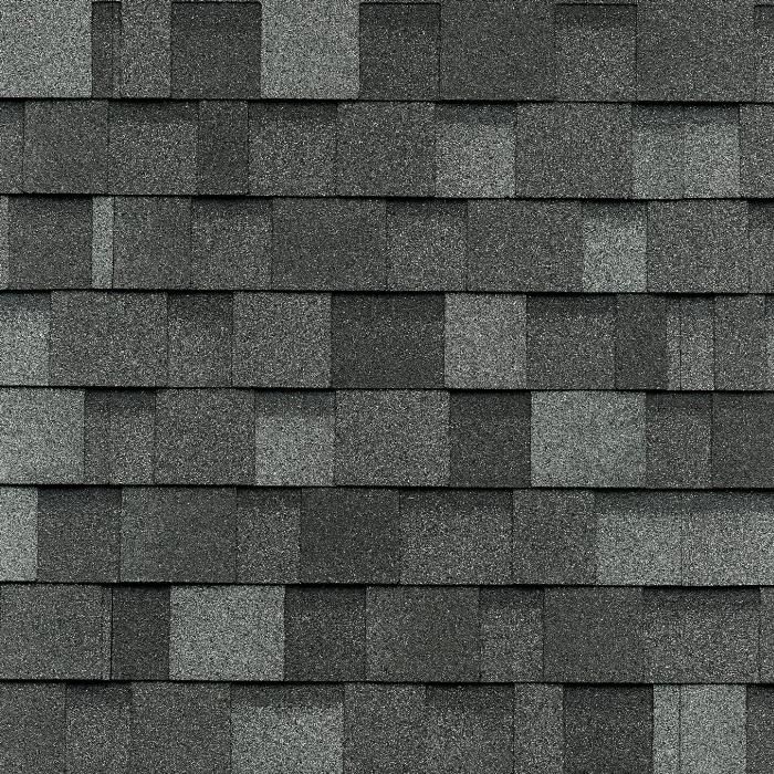 Bardeaux de toiture en asphalte gris posés en quinconce.
