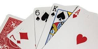Playing cards: seven of diamonds, six of spades, king of spades, and ace of hearts.