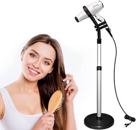 Image of female blow drying her hair with a hair dryer stand securely holding a hair dryer in place.