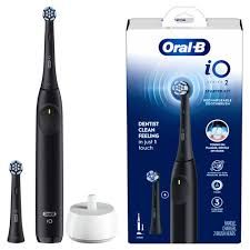 Image of black and blue Oral B Electric Toothbrush packaging with attachments.