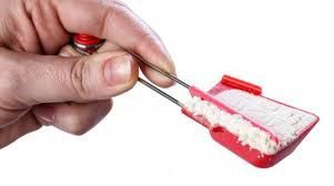 image of silver and red self-leveling measuring spoon