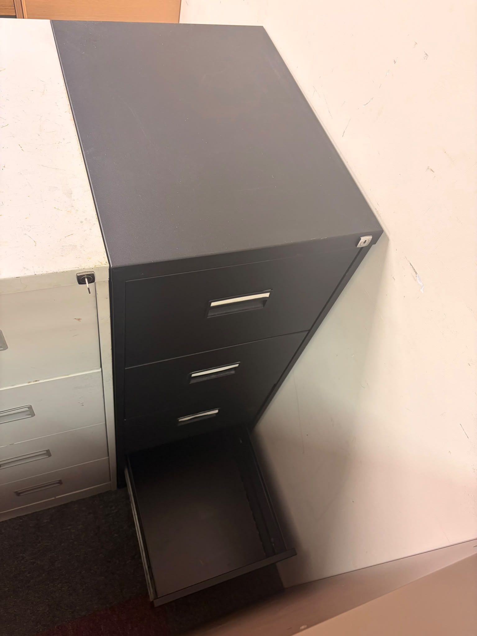 Used Black Four Drawer Filing Cabinet