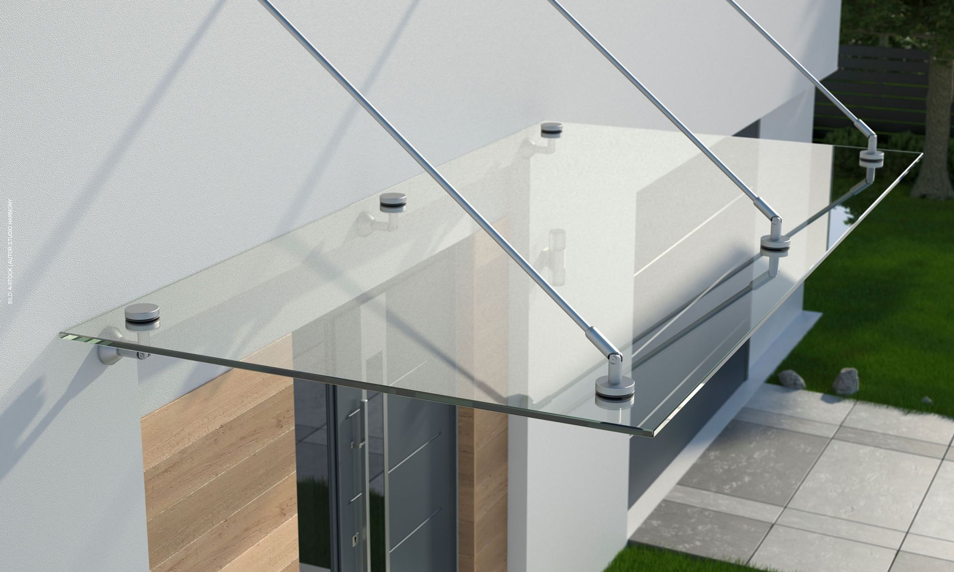 Ein weißes Gebäude mit einem Glasdach über der Tür. Haustürvordächer von Terrassenwelten Frank Merz