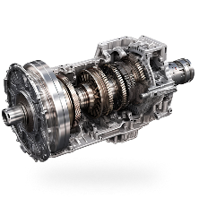 Cutaway view of an automatic transmission, showing gears and metal components. | Len's Automotive
