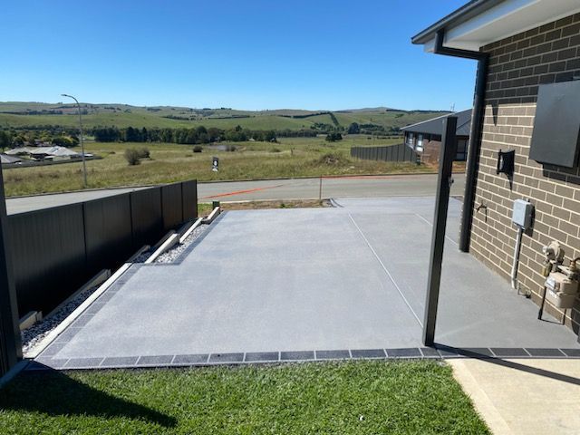 A Concrete Slab Is Sitting In The Middle Of A Dirt Field — Regional Concreting Solutions In Cudal, NSW