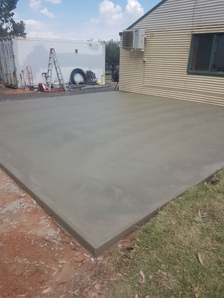 A Concrete Driveway Is Being Built In Front Of A House — Regional Concreting Solutions In Orange, NSW
