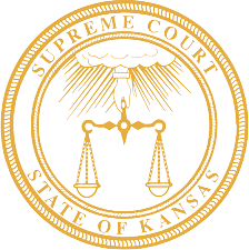 Seal of the Kansas Supreme Court: golden, scales of justice beneath a hand, text Kansas Supreme Court Approved Mediator Seal