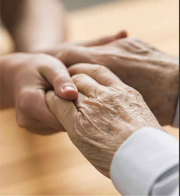 A young hand gently holding an elderly hand in a warm, soft-lit setting A young hand gently holding an elderly hand in a warm, soft-lit setting