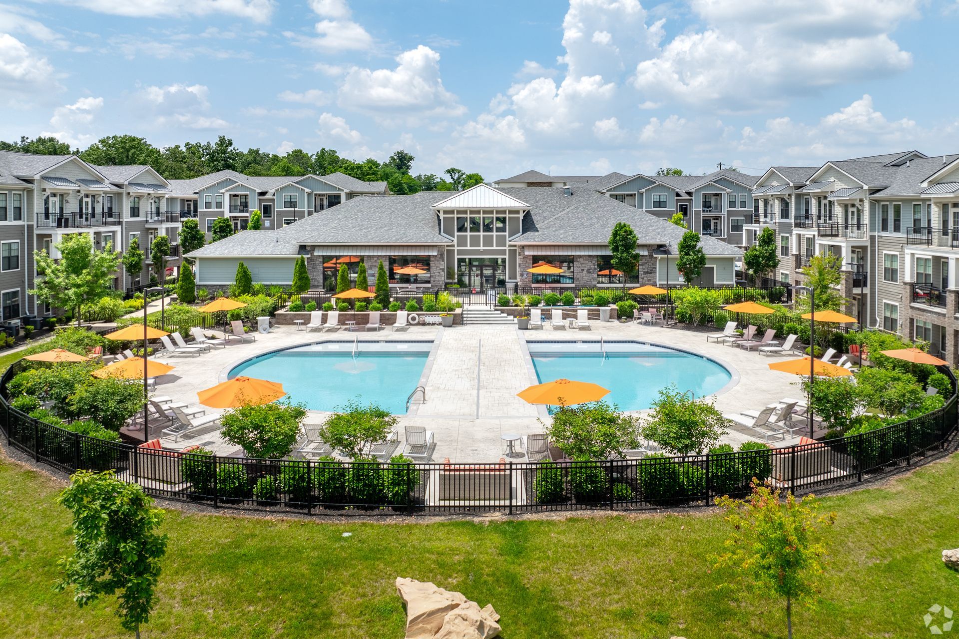 Haven on Tucker courtyard with a central swimming pool, lounge chairs, and surrounding greenery