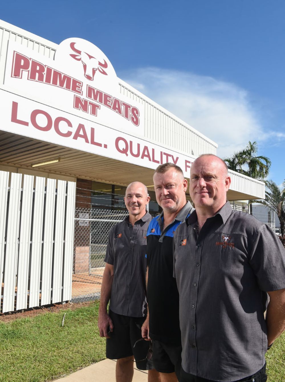 Three Men Are Standing in Front of a Building That Says Prime Meats β Prime Meats NT in Coconut Grove, NT
