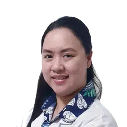 Portrait of a smiling woman in a white coat with a blue floral shirt against a white background