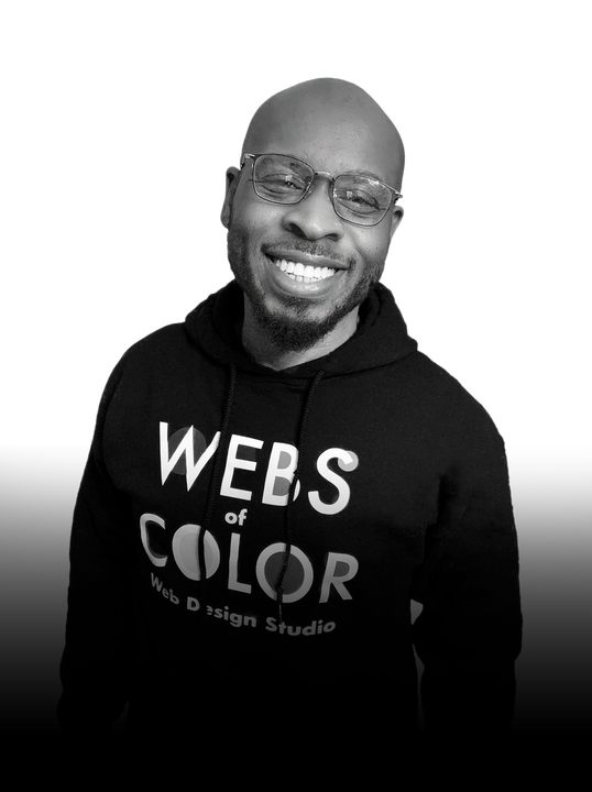 Black-and-white portrait of Corey Clauden-Cross, founder and creative director of Webs of Color
