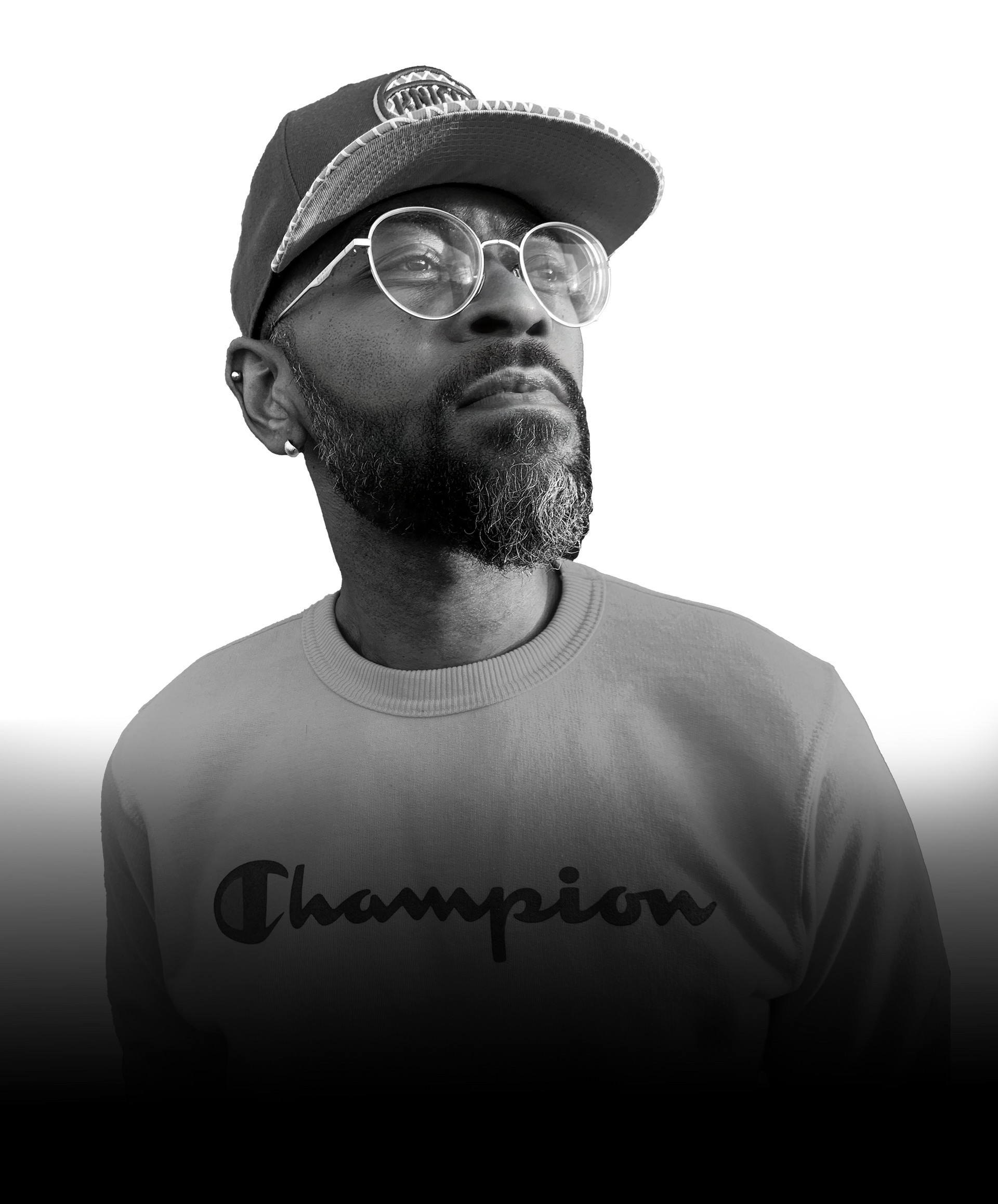 Man wearing glasses, a hat and a Champion sweatshirt