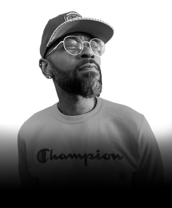Black-and-white portrait of Dr. Ricardo Clauden-Cross, Chief Operating Officer of Webs of Color