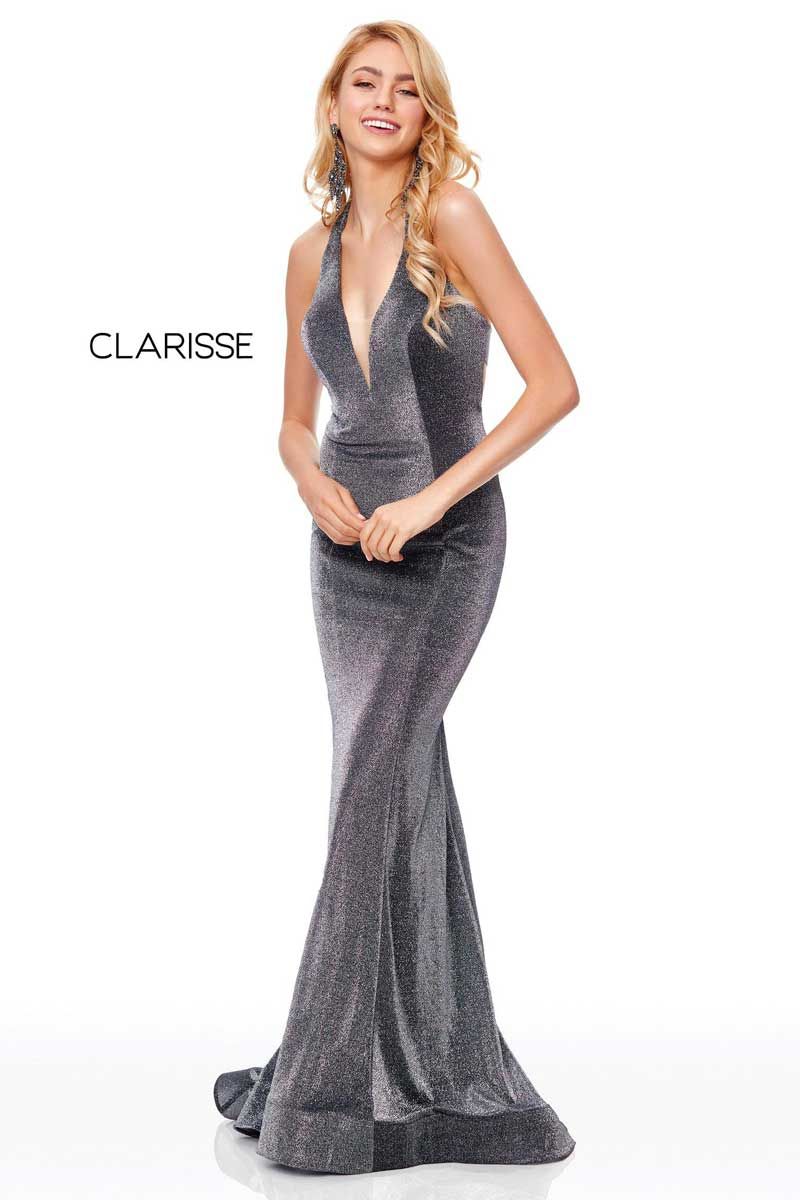 Blonde model in a sparkly gray evening gown posing on a white background.