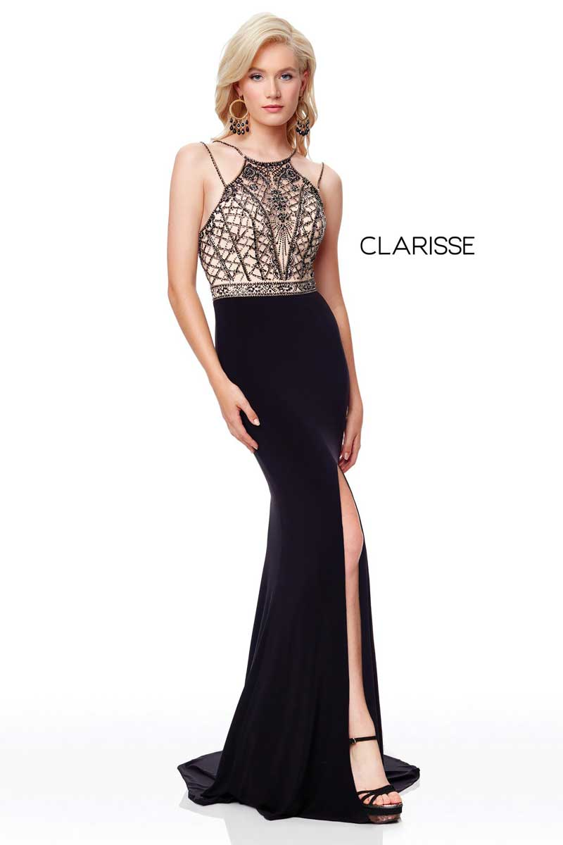 Blonde model in a black evening gown with a patterned bodice and thigh slit, standing against a white background.