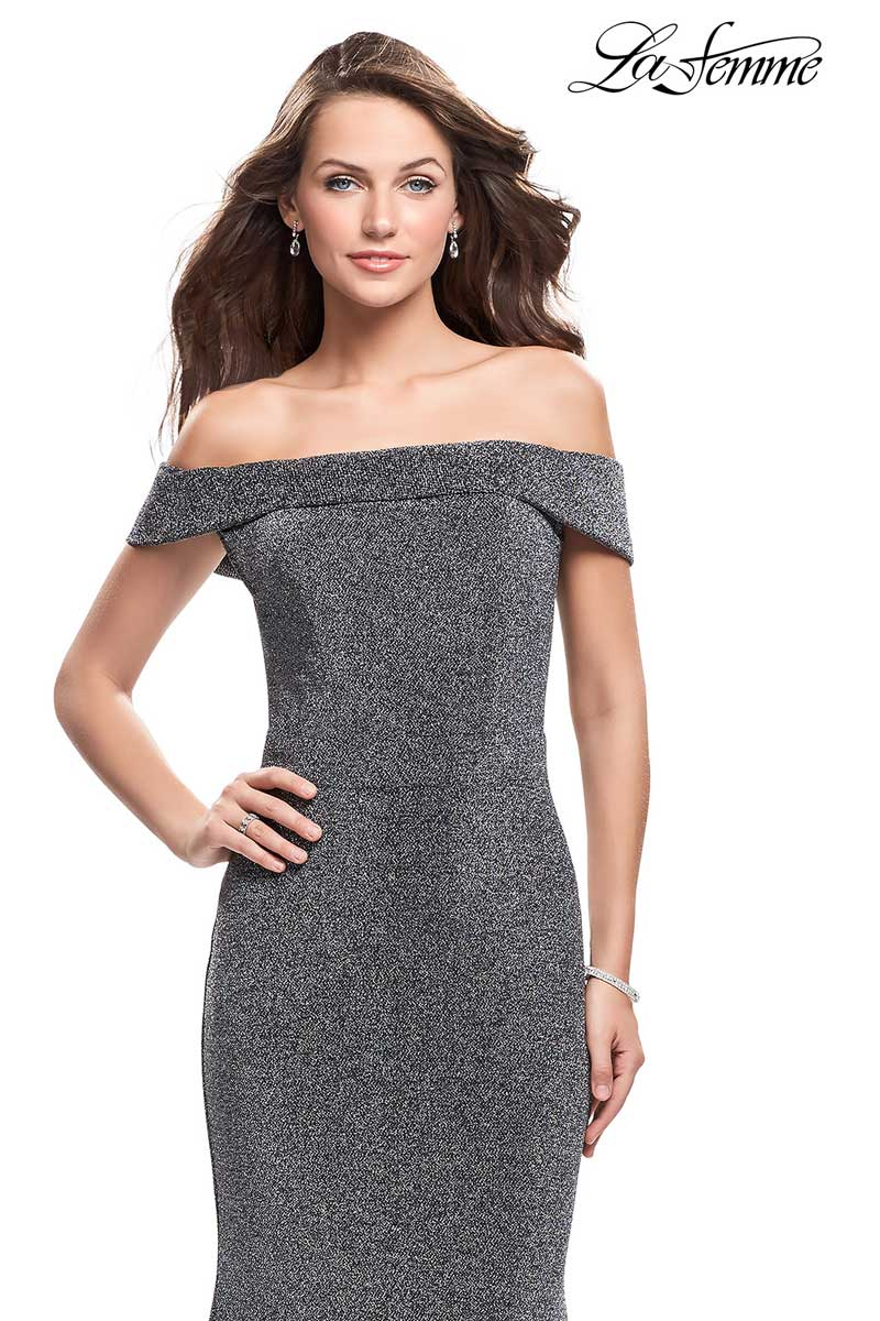 Woman modeling a gray off-shoulder fitted dress on a white background