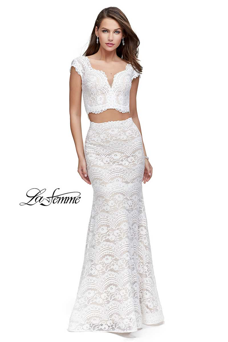 White lace two-piece formal gown with crop top and long skirt on a studio model