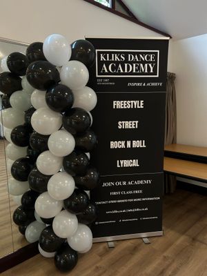 Young energetic dancer performs modern dance pose