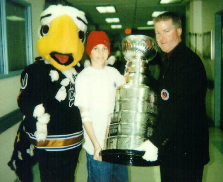 LBF Hero Ian Hahn holding the Stanley Cup Trophy