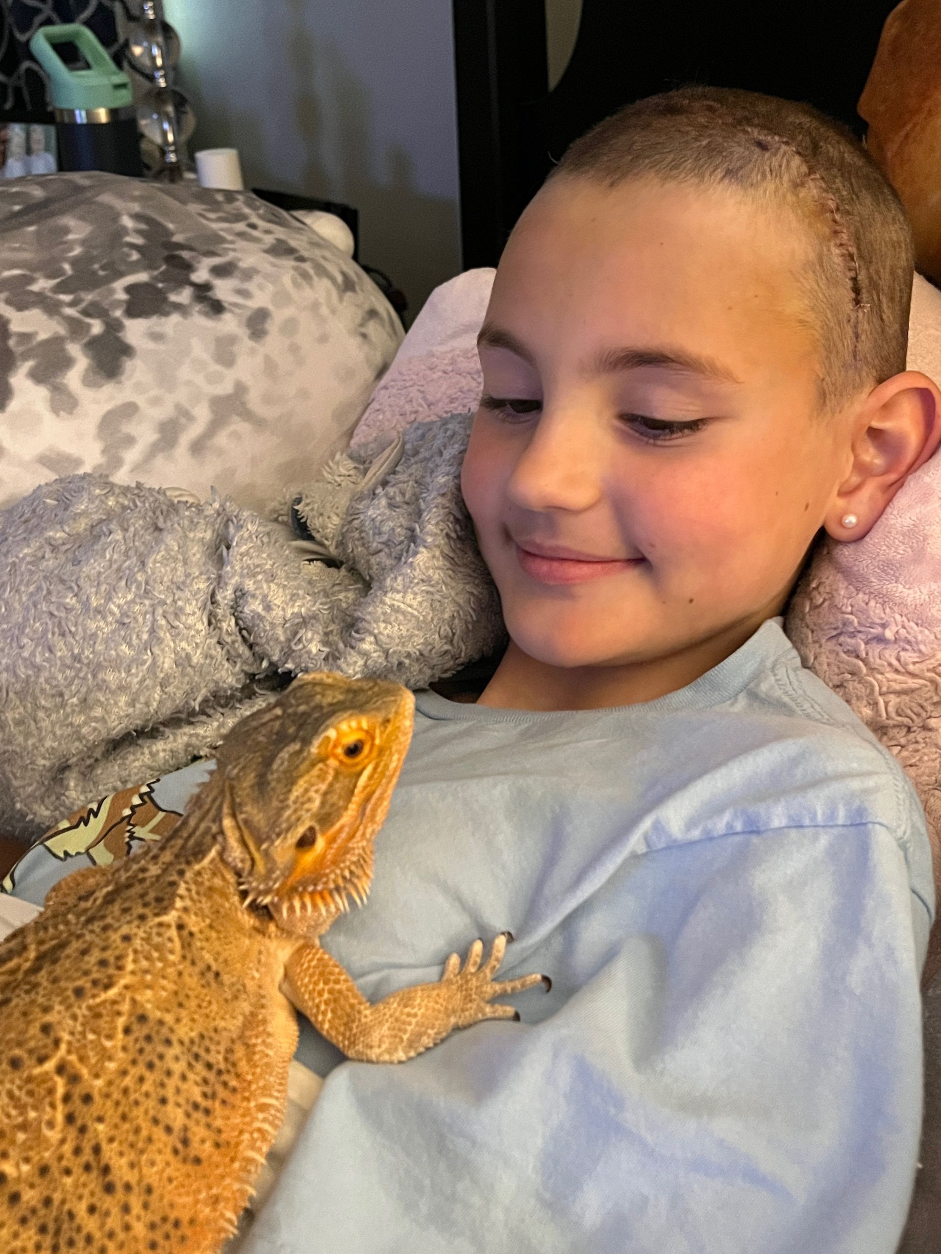 LBF Hero with iguana in hospital bed