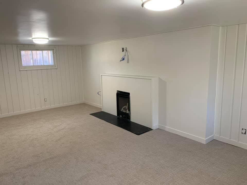 There is a fireplace in the middle of the room.