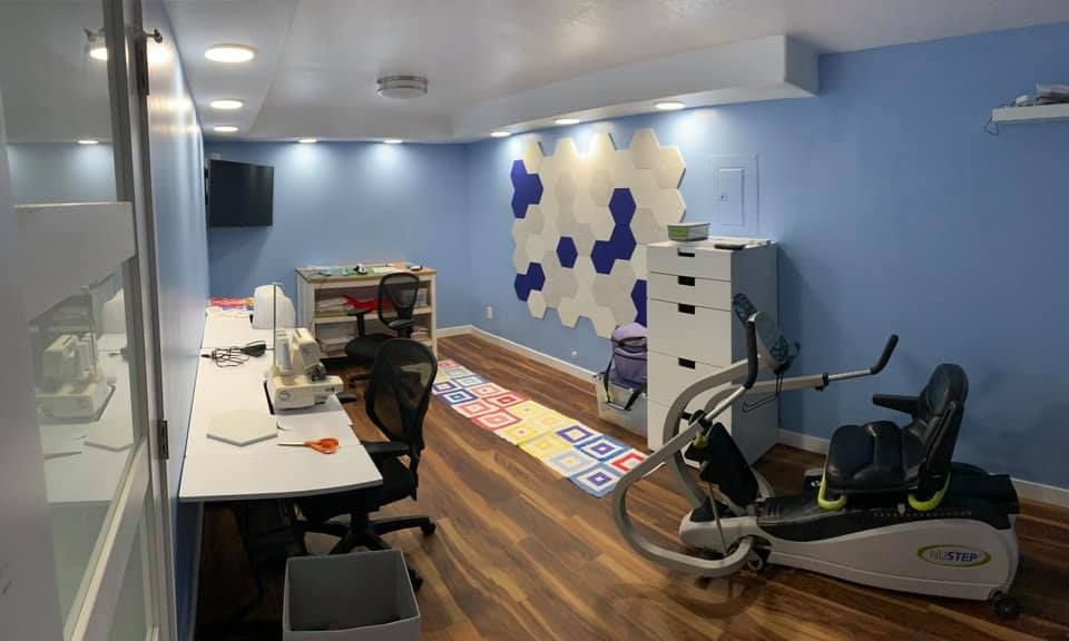 There is a treadmill in the middle of the room.