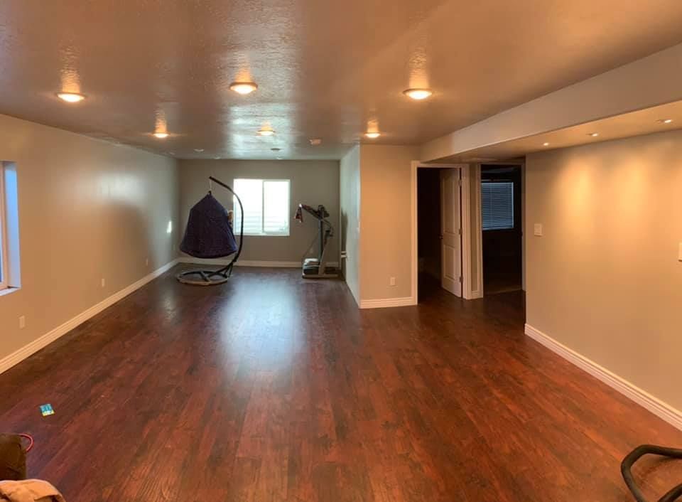 There is a hanging chair in the middle of the room.
