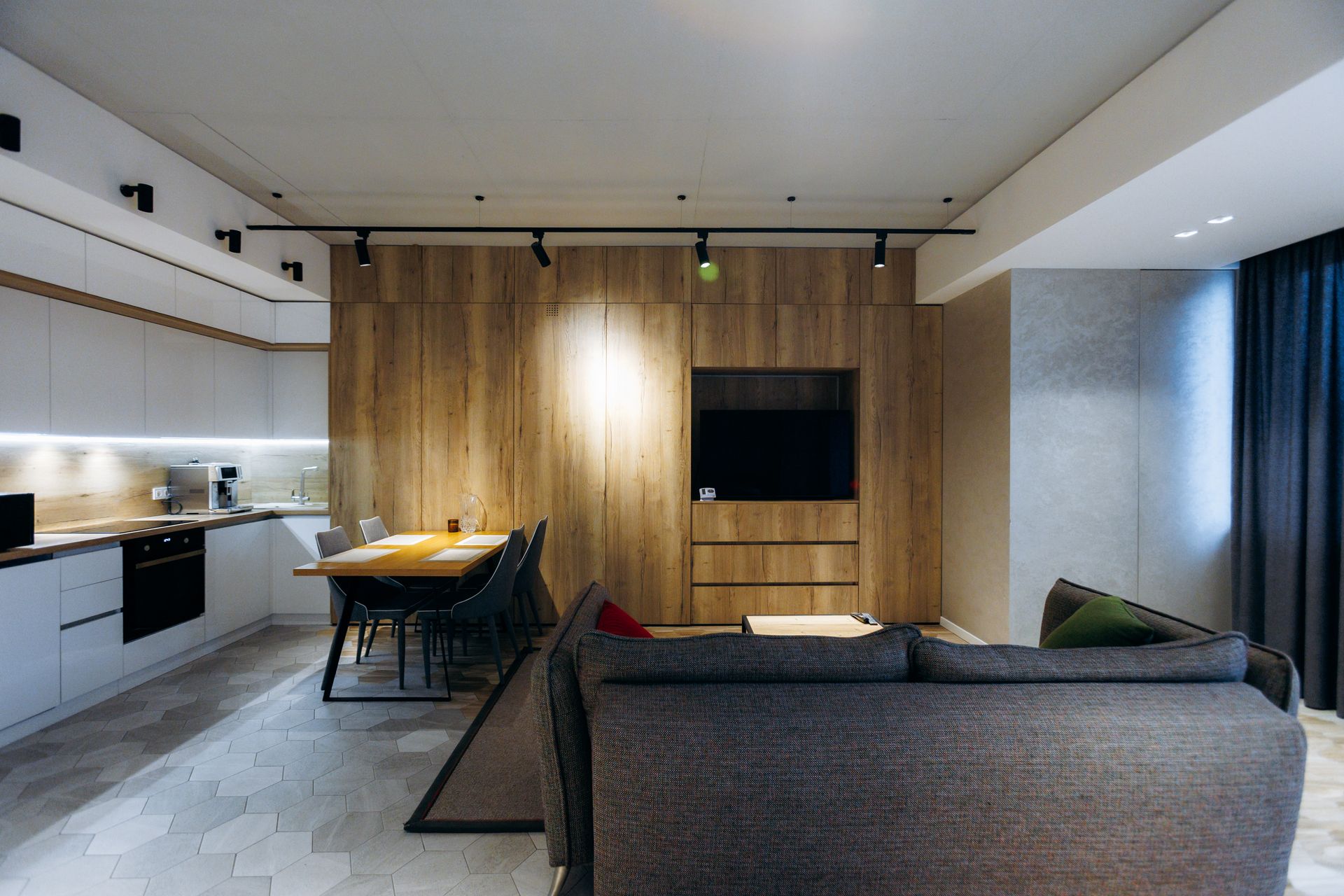 An open concept space with living and kitchen areas