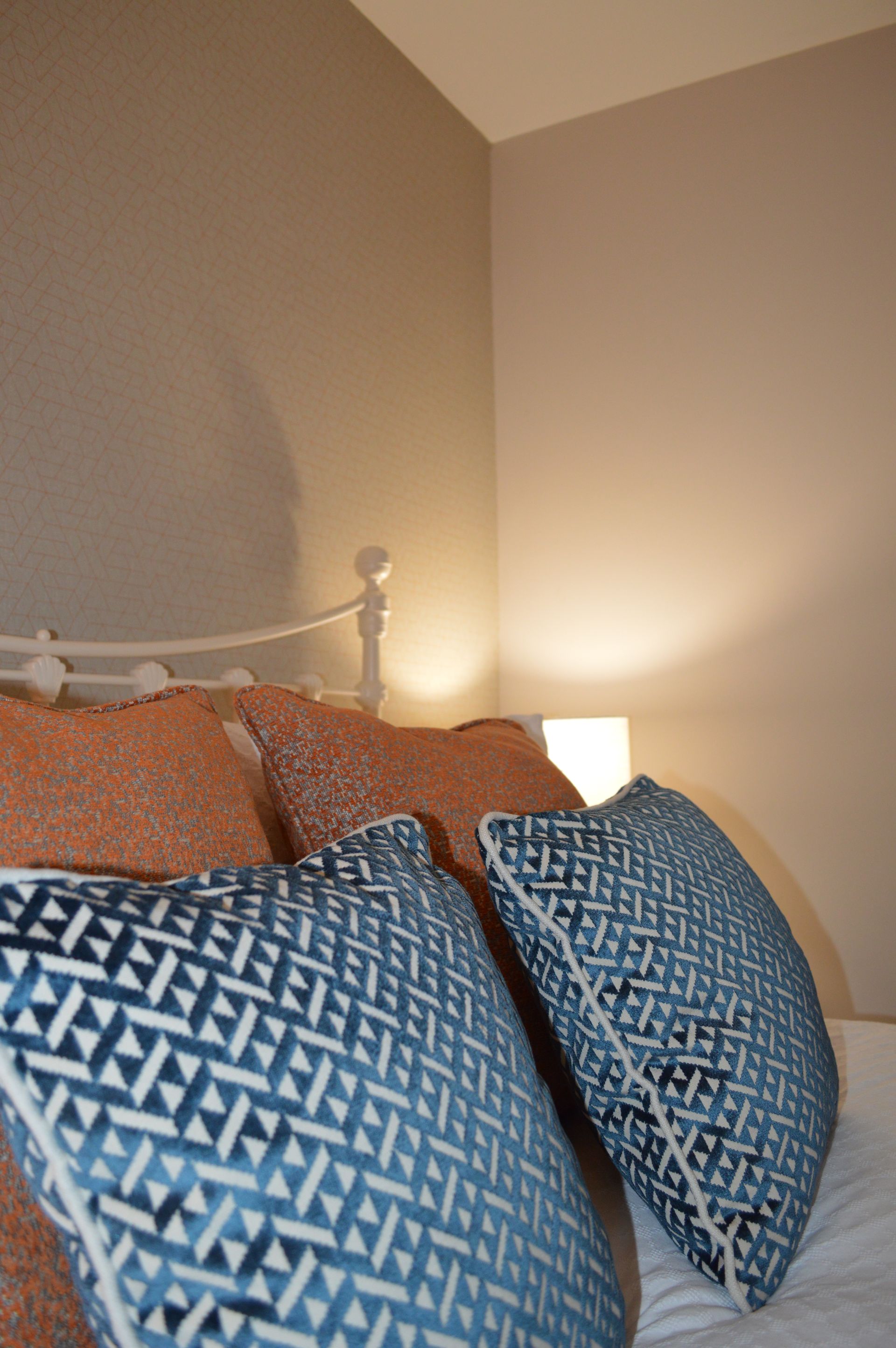 A bed with a lot of pillows on it