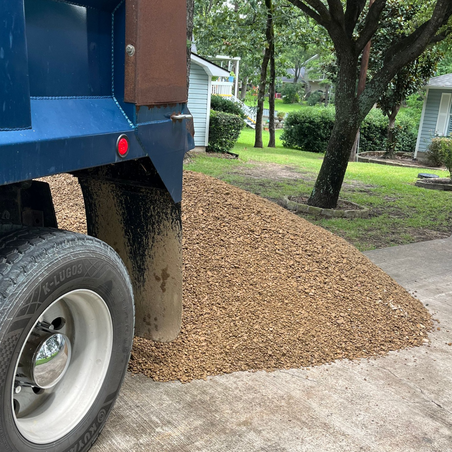 A person is holding a handful of sand in their hand.