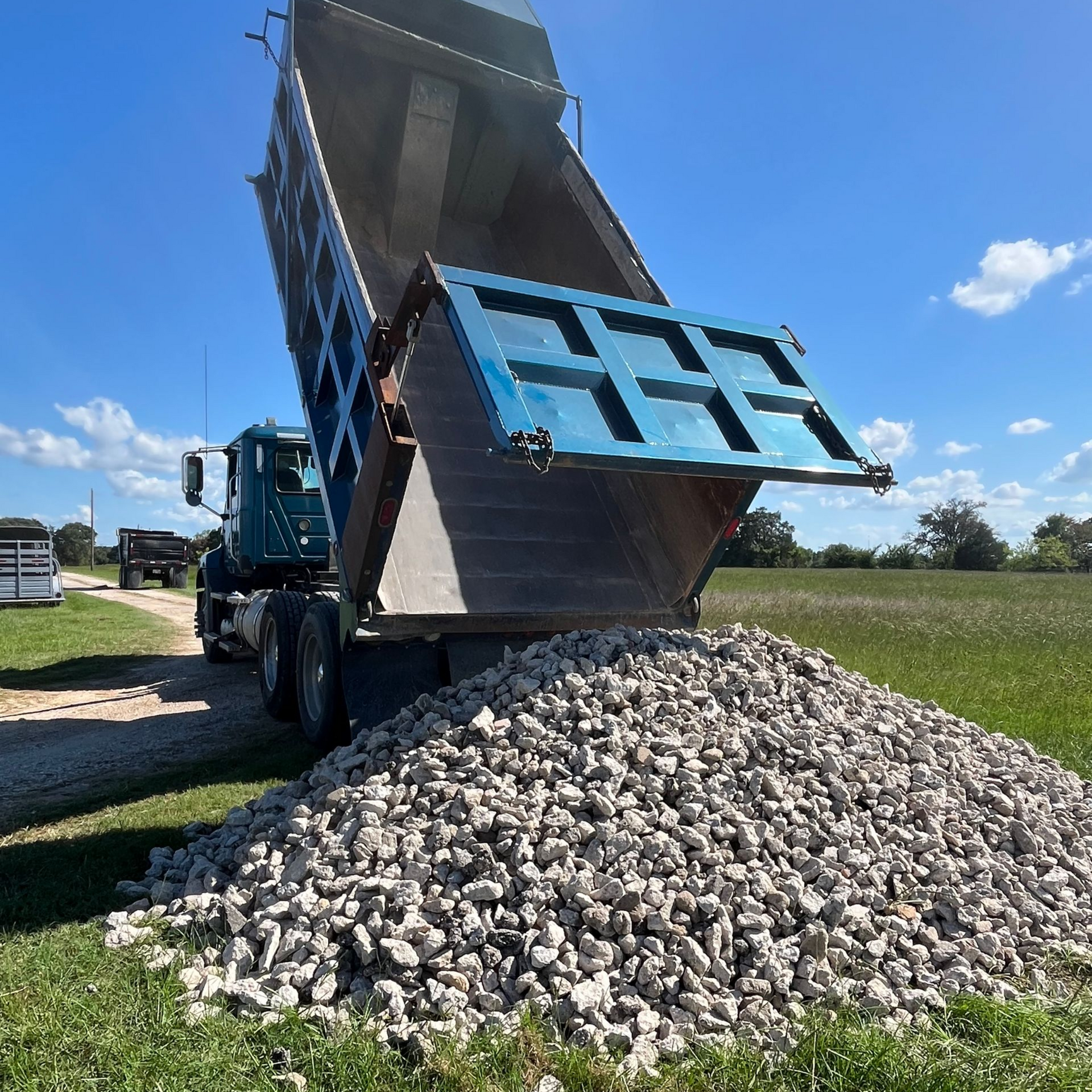 A pile of rocks with a cloudy sky in the background.