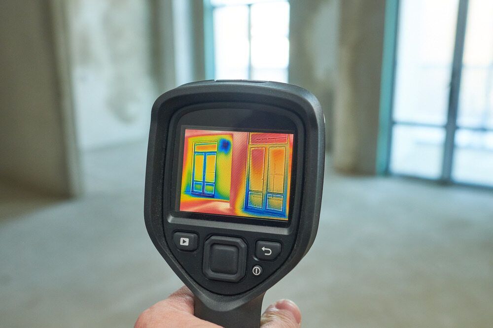 A Hand Holds a Thermal Imaging Camera — Leak & Co in Palmerston, NT