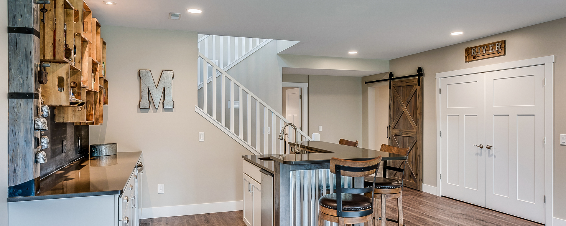There is a staircase leading up to the second floor in the basement.