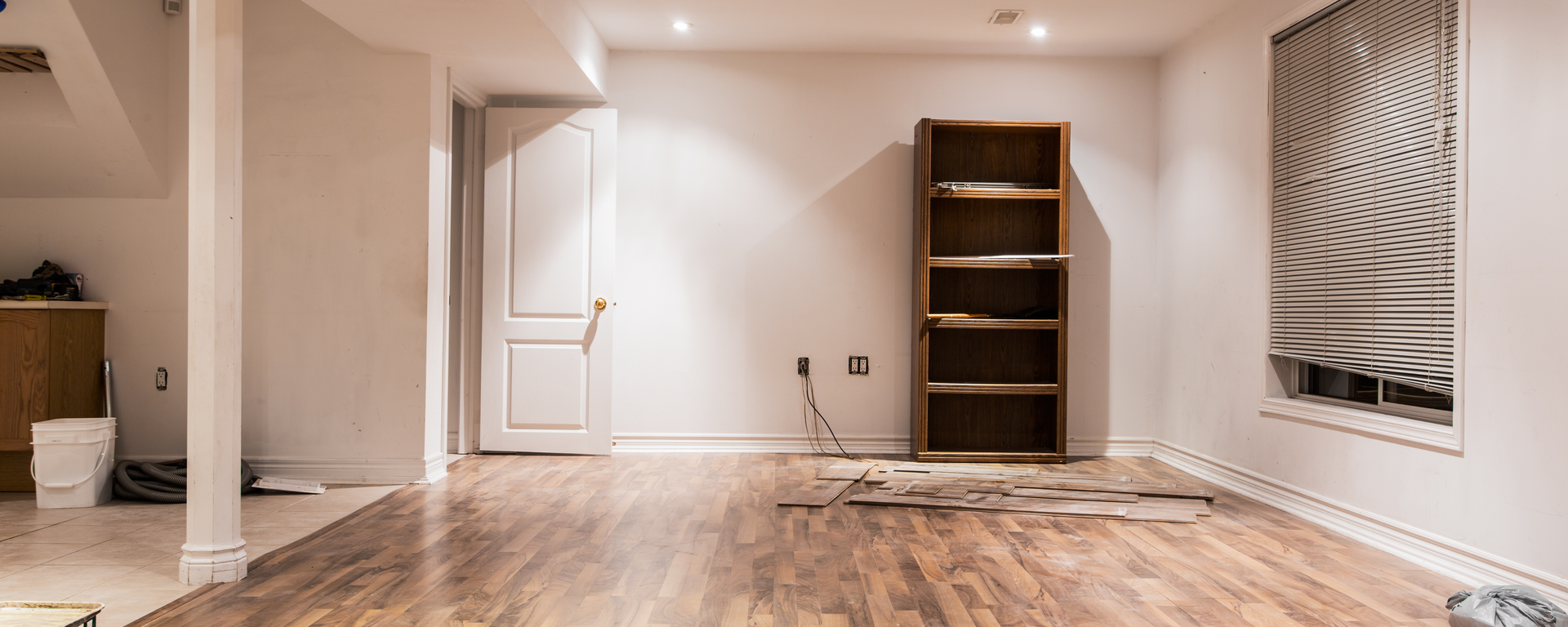 There is a bookshelf in the middle of the room.