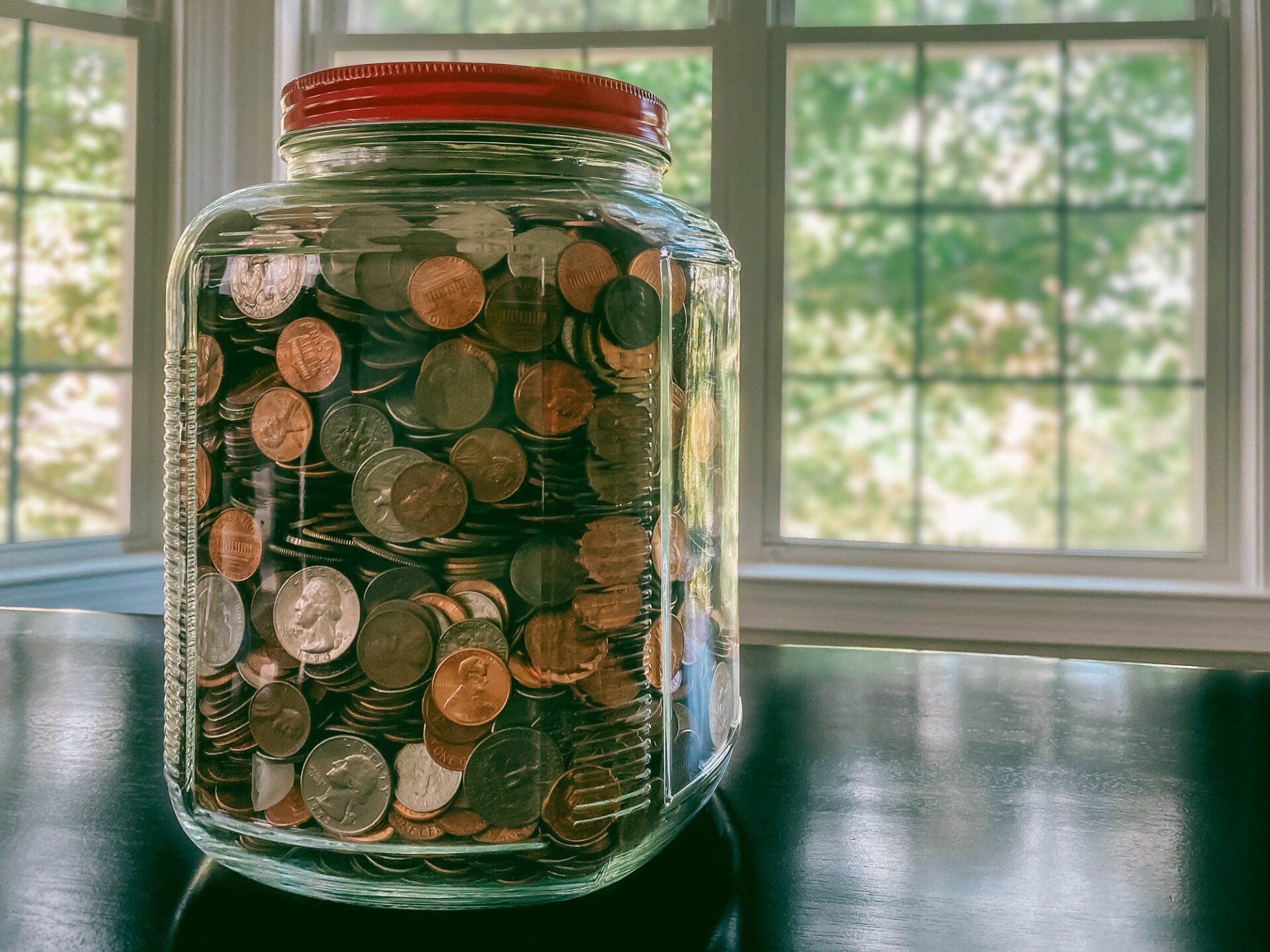 Glass Jar Filled with US Coins — Hobart, IN — C&D Jewelry & Collectables