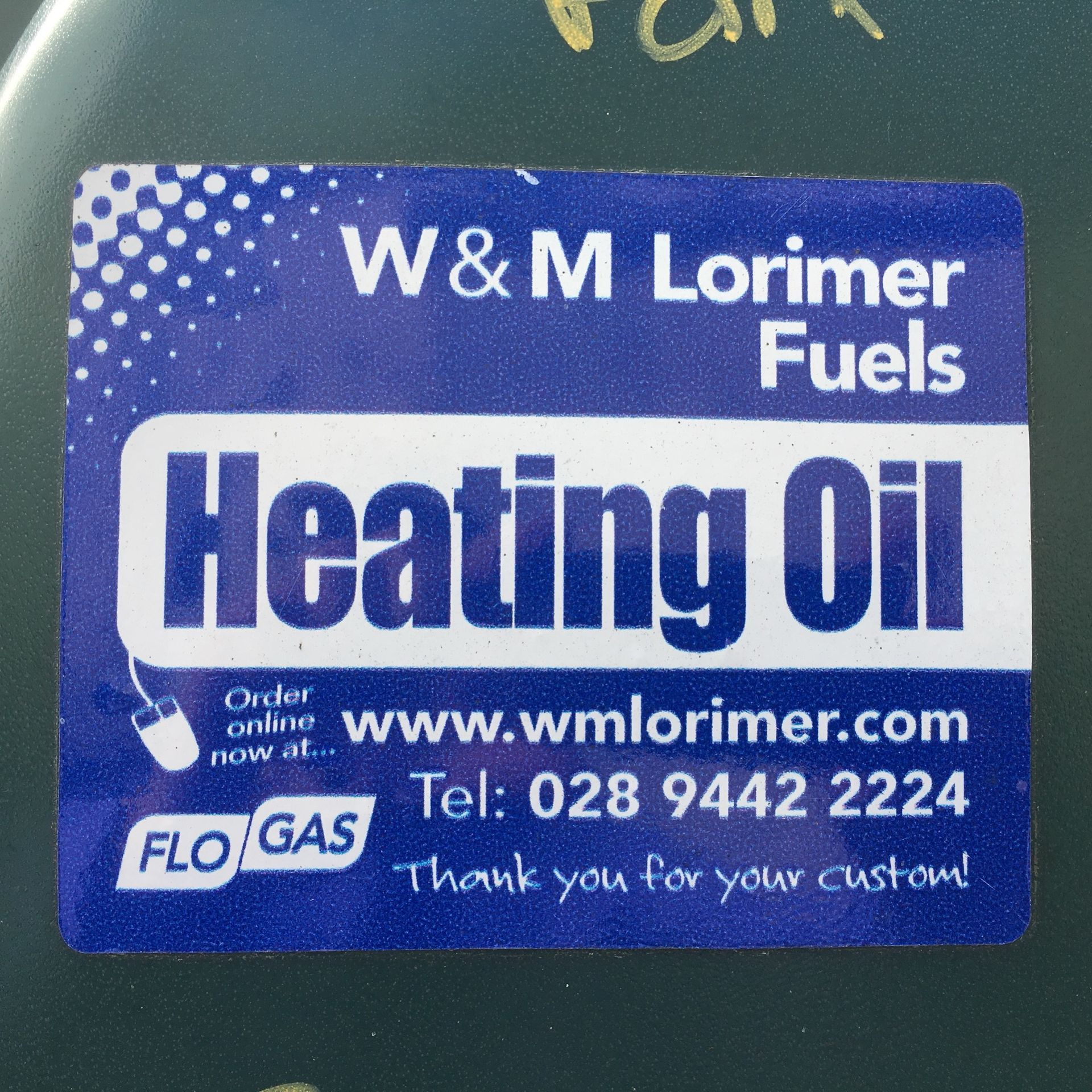 Product identification labels can help reduce the risk of mis-fuelling Photograph of a product identification label, issued by W&M Lorimer Fuels, fitted to a green, plastic heating oil tank.