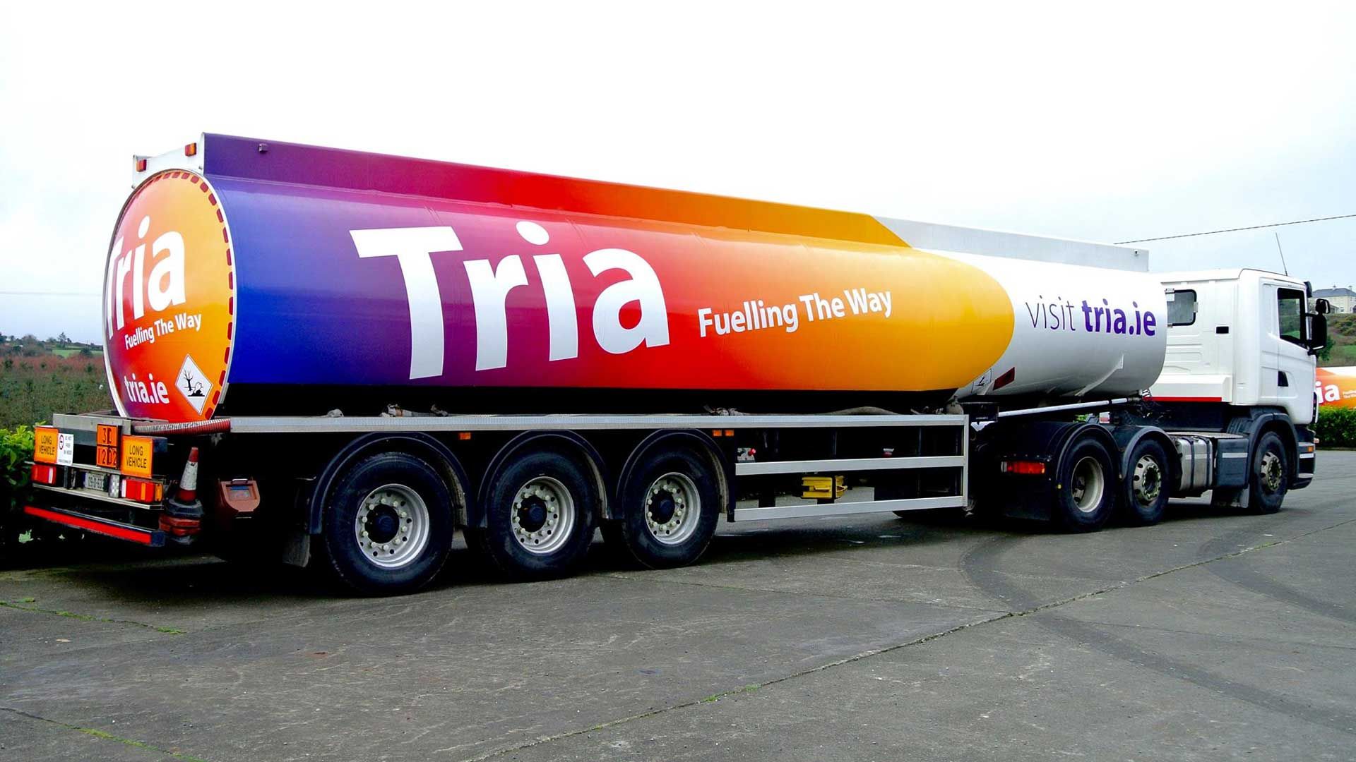 Photograph of of a Tria Energy articulated heating oil tanker, with Scania tractor unit. 
