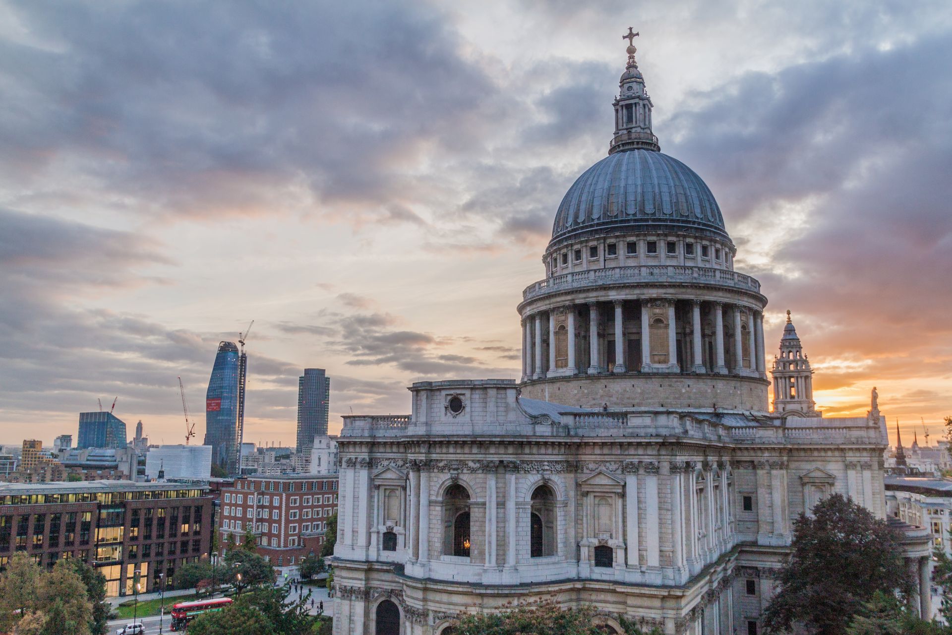 St. Paul’s Cathedral at sunset, with London skyline and cloudy sky in the background