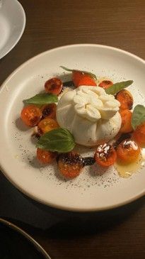 Burrata cheese with cherry tomatoes and fresh basil Burrata cheese with cherry tomatoes and fresh basil