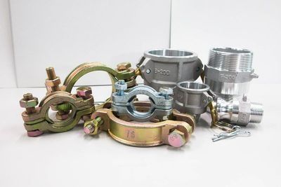 A Group Of Pipe Clamps Are Sitting On Top Of Each Other On A Table — NQPT In Garbutt, QLD