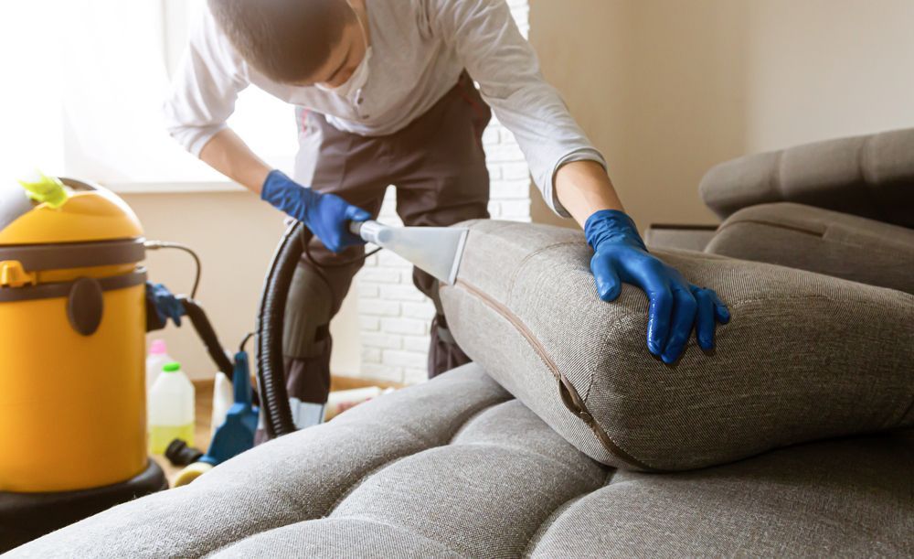 Man Cleaning the Sofa