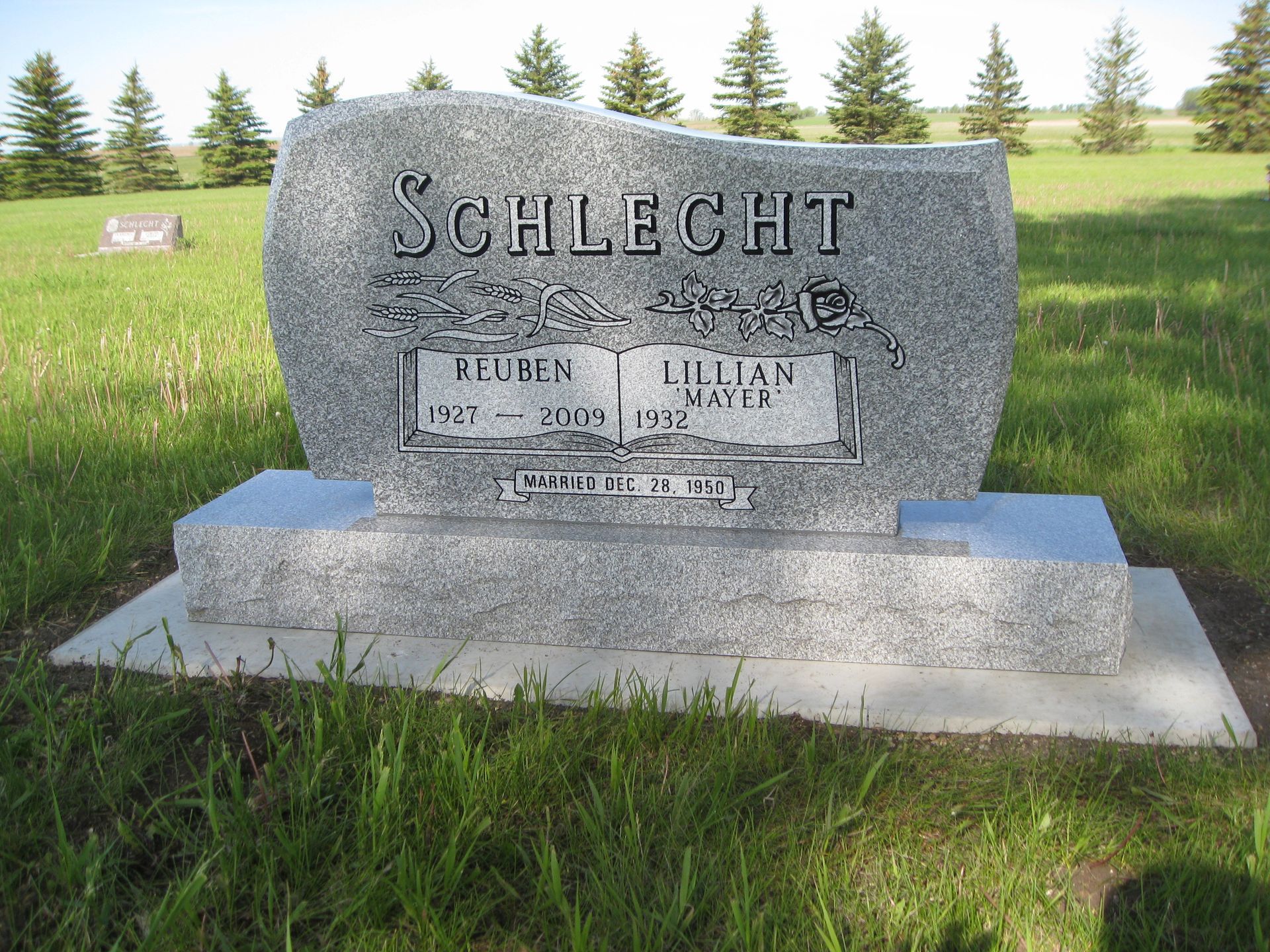 Granite headstone in a cemetery with the name