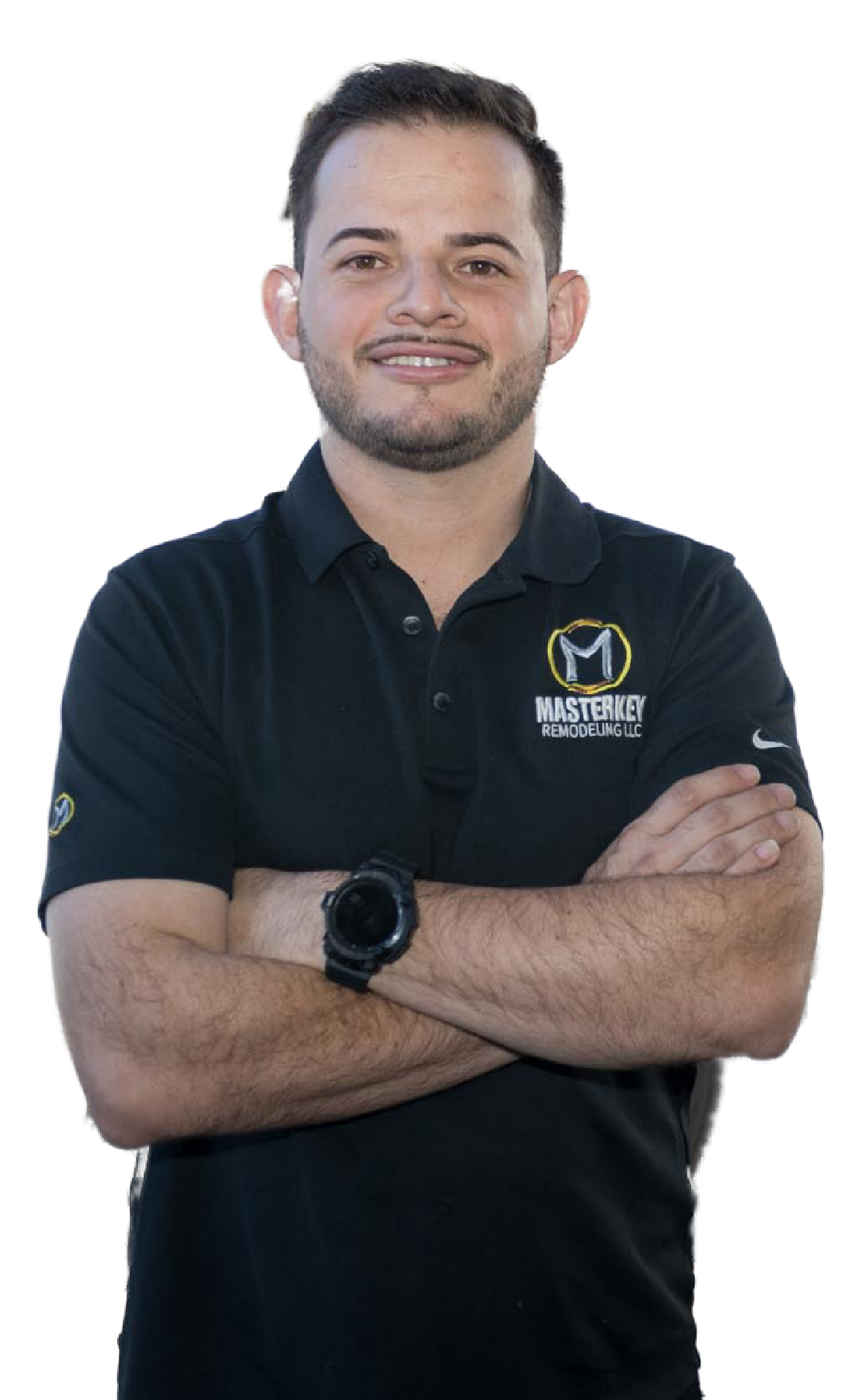 A man with a beard is wearing a black polo shirt with his arms crossed.