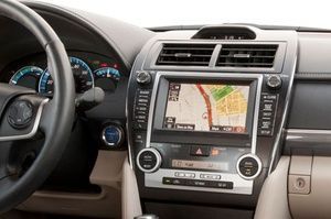 The dashboard of a car with a navigation system.