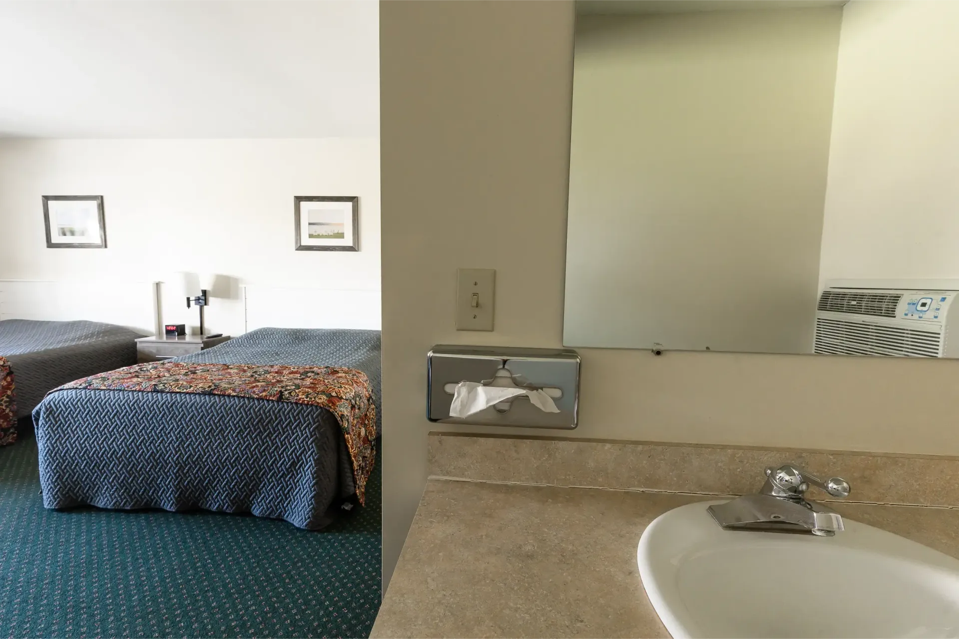 A hotel room with two beds and a sink