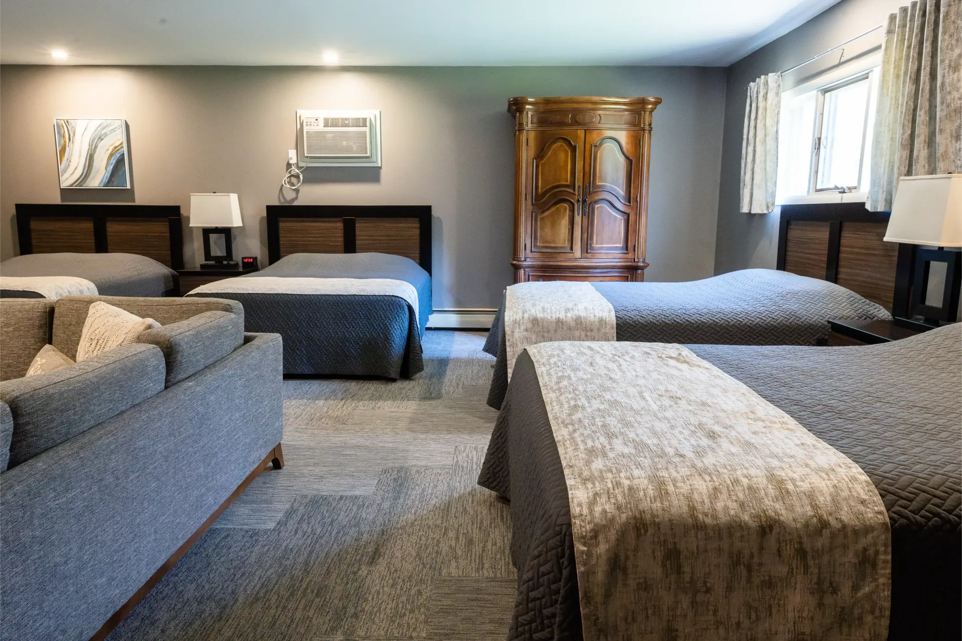 A hotel room with two beds and a mirror