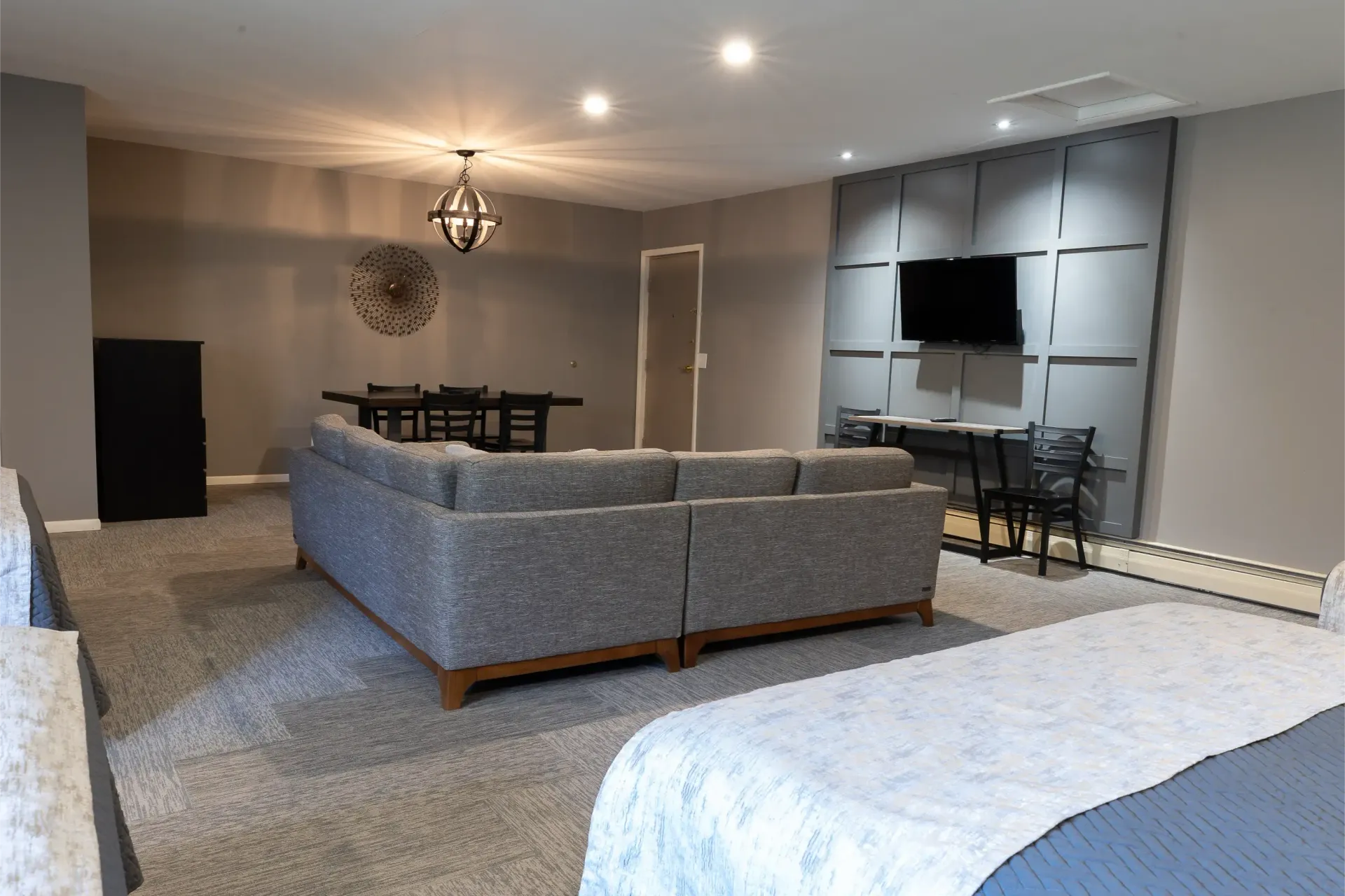 A living room with a couch and a bed