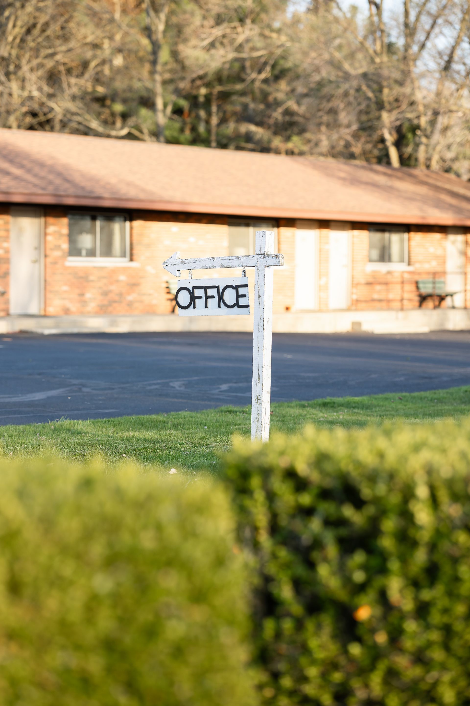 A house with a for sale sign in front of it.